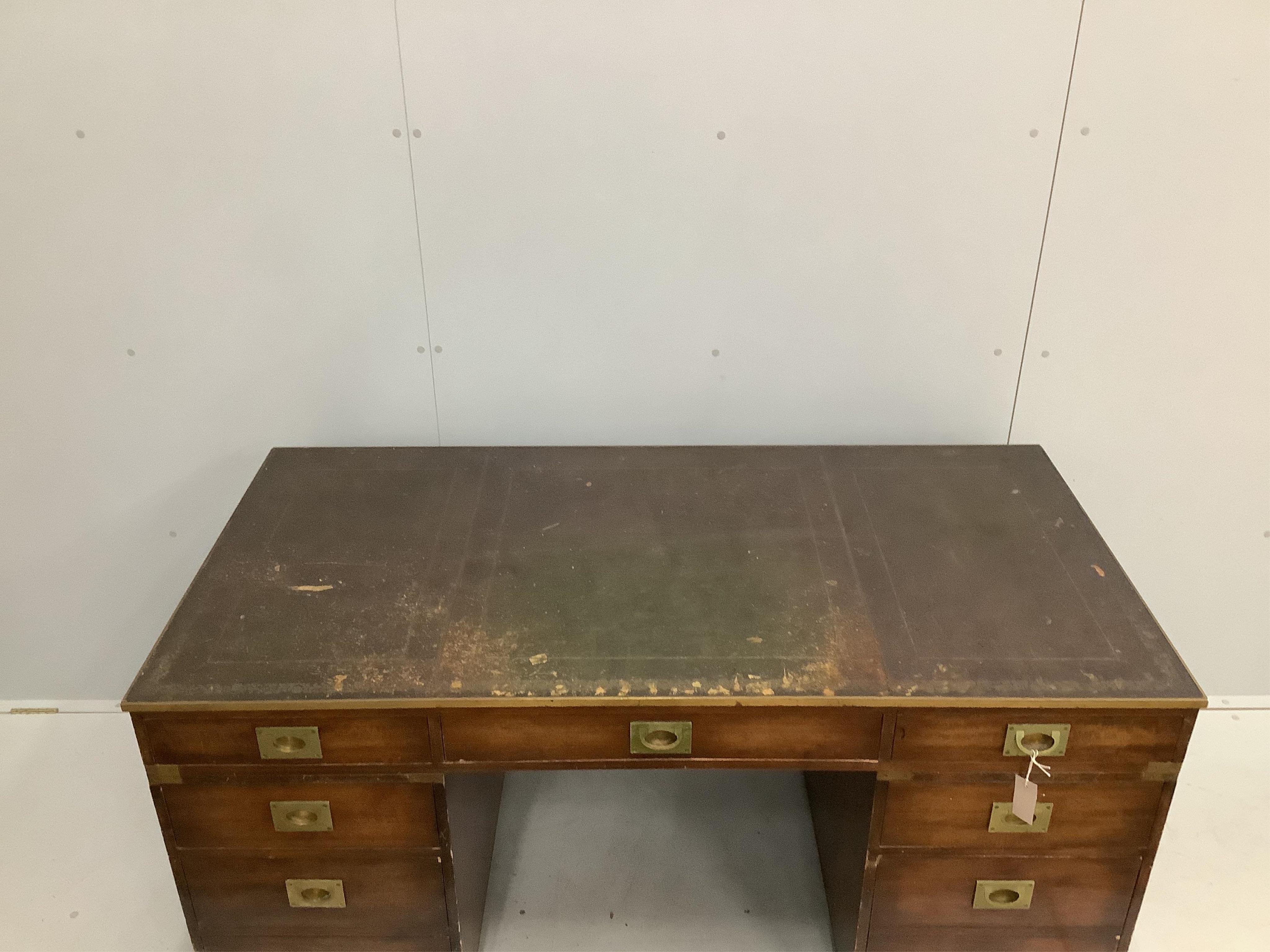 A mid century brass mounted military style mahogany twin pedestal desk, width 153cm, depth 77cm, height 75cm. Condition - fair